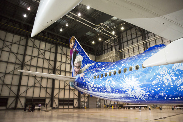 (Oct. 18, 2015): There’s a new aircraft joining the WestJet fleet today. It’s a special, custom-painted Disney “Frozen”-themed plane featuring Anna, Elsa and Olaf from the beloved Disney film. Disney artists, cast members and WestJetters collaborated to design the “Frozen”-themed aircraft. Similar to the earlier Magic Plane, the outside of the aircraft tells a story. While the Disney “Frozen”-themed plane is inspired by Walt Disney World Resort, it will operate flights throughout WestJet’s network, not just to Orlando.