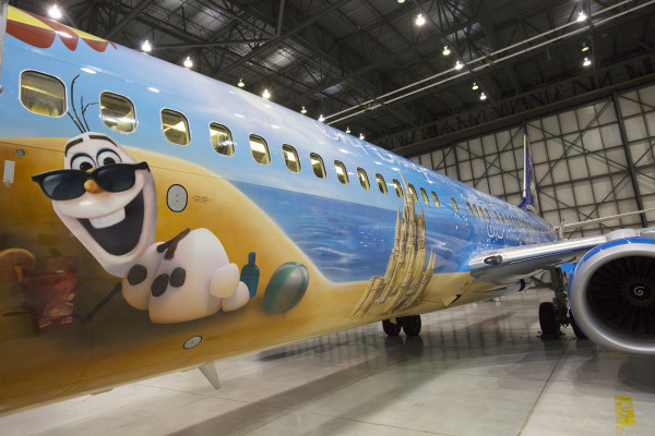 (Oct. 18, 2015): There’s a new aircraft joining the WestJet fleet today. It’s a special, custom-painted Disney “Frozen”-themed plane featuring Anna, Elsa and Olaf from the beloved Disney film. Disney artists, cast members and WestJetters collaborated to design the “Frozen”-themed aircraft. Similar to the earlier Magic Plane, the outside of the aircraft tells a story. While the Disney “Frozen”-themed plane is inspired by Walt Disney World Resort, it will operate flights throughout WestJet’s network, not just to Orlando.