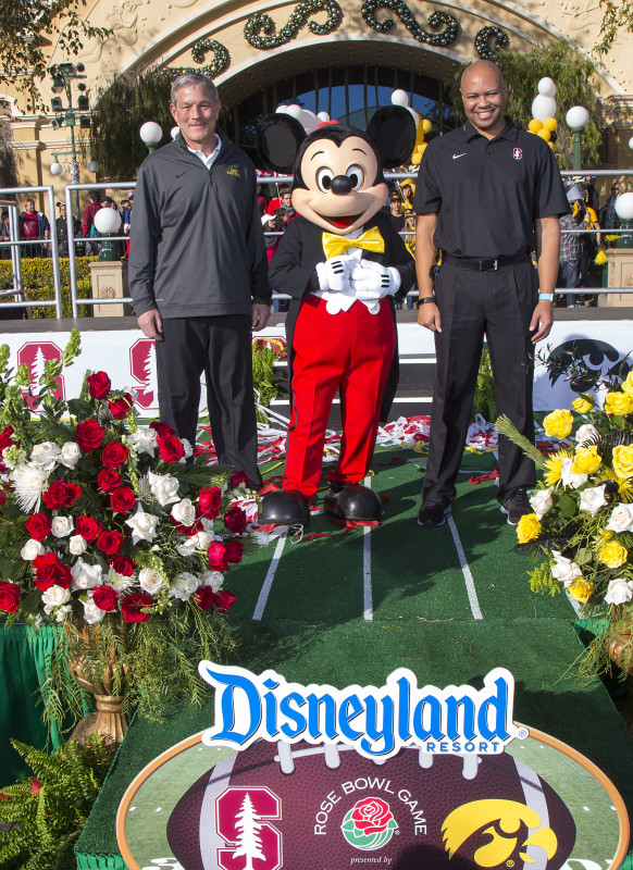 (December 26, 2015)  The No. 5 CFP-ranked Iowa Hawkeyes, champions of the Big Ten West Division, and No. 6 CFP-ranked Stanford Cardinal, champions of the Pac-12 Conference, made their first official appearances of the Rose Bowl Game week during a ceremony at Disney California Adventure Park in Anaheim, Calif., on Saturday. Iowa Head Coach Kirk Ferentz and Stanford Head Coach David Shaw were joined by Mickey Mouse. (Scott  (Paul Hiffmeyer/Disneyland)